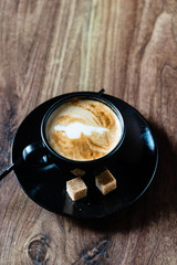 cup of cappuccino with brown sugar