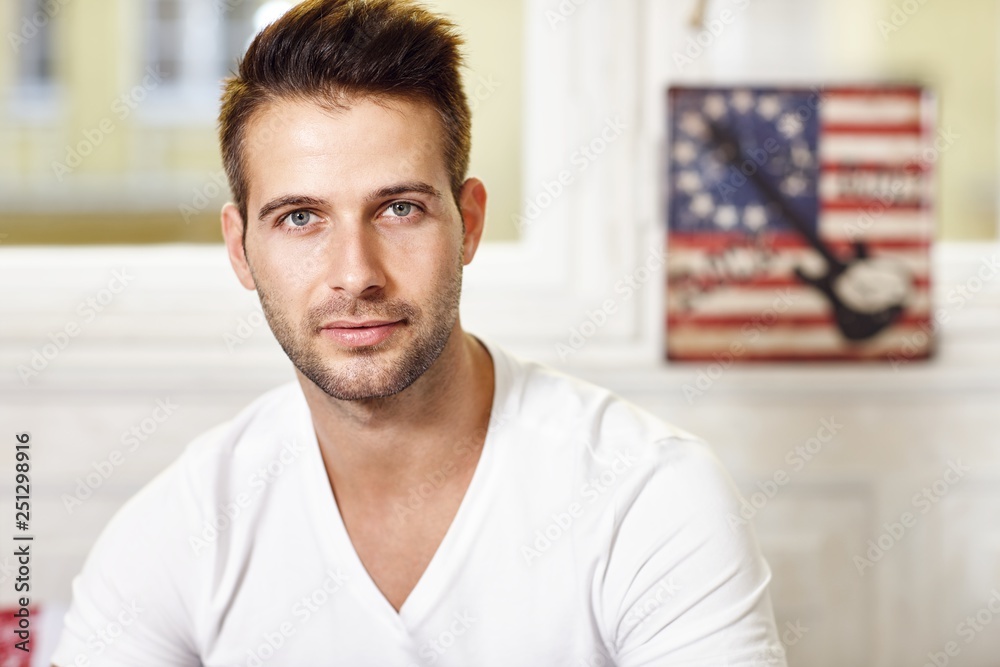 Wall mural Portrait of handsome young man