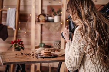 Female food photographer working in home studio