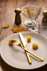 Beautiful table setting on wooden background
