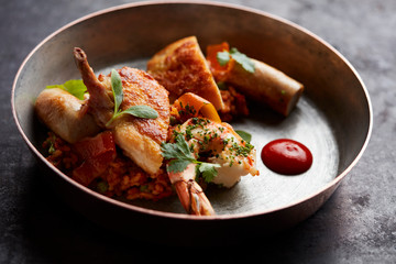 Chicken, prawn and sausage with risotto