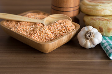 Tarhana soap in the wooden plate with traditional spoon and garlic for kitchen and food photo concept.