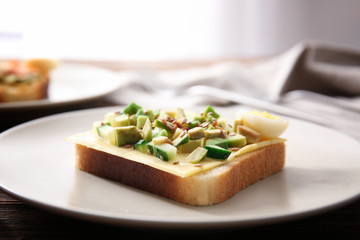 Tasty avocado sandwich on plate, closeup