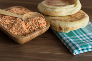 Tarhana soap in the wooden plate with traditional spoon and garlic for kitchen and food photo concept.