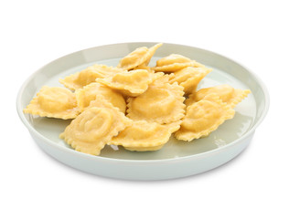 Plate with tasty ravioli on white background