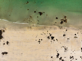 Aerial view. Sea water and sandy shoreline