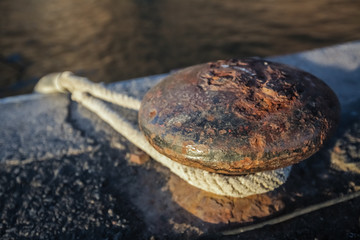 Bollard with a chain and a rope