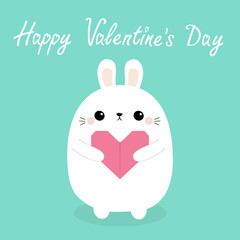 Happy Valentines Day. White baby rabbit hare puppy head face holding pink origami paper heart. Cute cartoon kawaii funny animal character. Love card. Flat design. Isolated. Blue background.