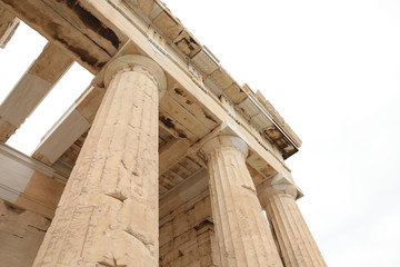 Athens, Greece - February 23, 2019: Fragment of Ancient Greek architectural elements of eastern facade of the Athenian Acropolis PROPYLAEA serves as the entrance to the Acropolis in Athens.
