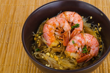 Glass noodles with sauce and shrimps, asian cuisine.