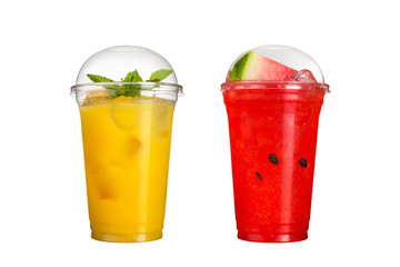 Delicious fruit smoothies in plastic cups, on a white background. Two cocktails with watermelon and pineapple.