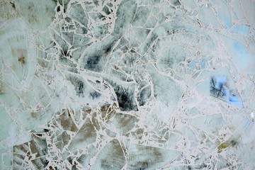 Mirror surface of glass fragments with patina and antique effect.