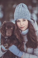 girl with her puppy winter walk