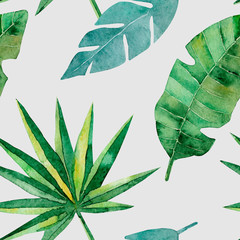 Seamless pattern with green tropical palm and monstera leaves. Exotic and jungle trendy style. Hand drawn watercolor illustration. Exotic hawaiian summer design for print, printing on paper or fabric