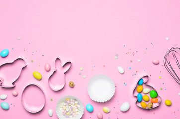 Easter Concept, Cookie Cutters, Eggs, Sugar Sprinkles and Chocolate Eggs on Bright Background