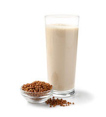 Glass of tasty buckwheat milk on white background