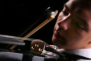 Young men playing the violin