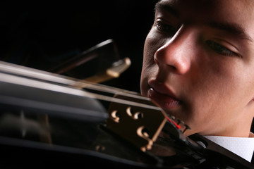 Young men playing the violin