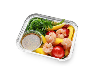 Container with delicious food for delivery on white background