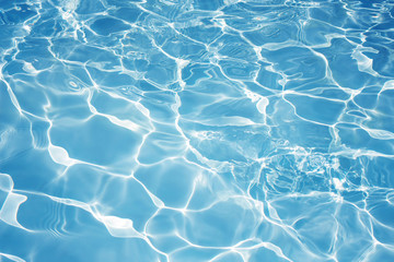 Texture of water in swimming pool for background