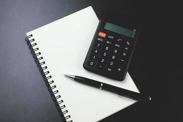 calculator with a notepad on the table
