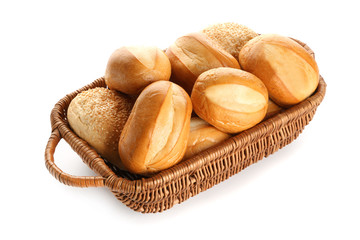 Basket with delicious fresh buns on white background