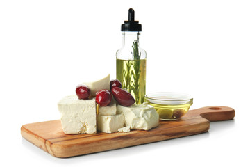Fototapeta na wymiar Composition with tasty feta cheese and olive oil on white background