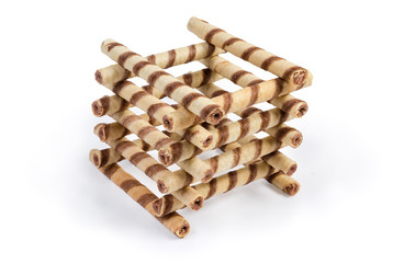 Striped wafer tubes with chocolate cream stacked in tower