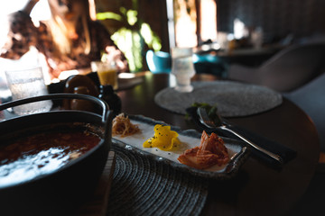 Beautiful pan-Asian food in a restaurant with a beautiful interior and a girl in the background