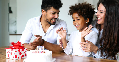 Happy family celebrating birthday of their child