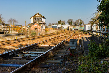 Fototapeta premium Train tracks heading off in to the distance on a bright and sunny day