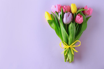 Bouquet of beautiful tulips on color background