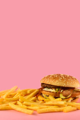 urger with fries. takeaway lunch, fast food restaurant, fast food menu. pink  background, selective focus and copy space