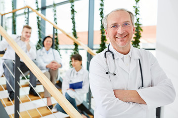 Senior as successful doctor or chief physician