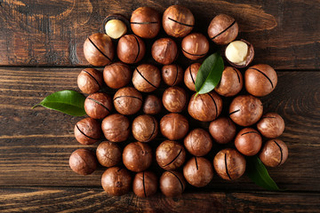 Tasty macadamia nuts on wooden table