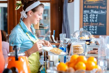 Woman holding pastries in tray