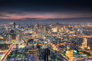 Fototapeta na wymiar Cityscape of crowded building with light traffic at Bangkok city