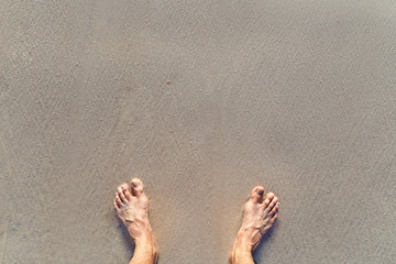 Foots on the sand
