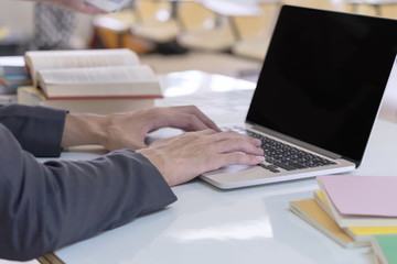 Man hands using computer laptop. Business and Education concept.