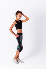 Young athletic girl isolated on white background.