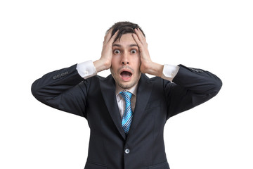 Worried funny businessman is holding his head. Isolated on white background.