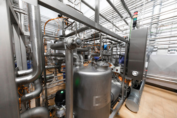 Steel tanks or vats , pipe lines and other equipment tool in plant workshop