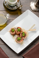 Skewers of bacon-wrapped salmon