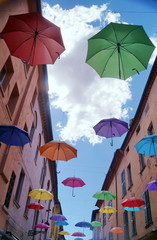 Giuseppe Mazzini street with hanging umbrellas, Ferrara, Italy