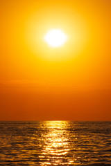summer sea landscape with orange sky at sunset