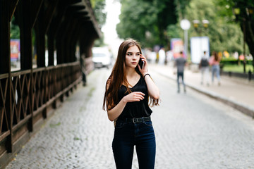 young girl posing on a street in the city