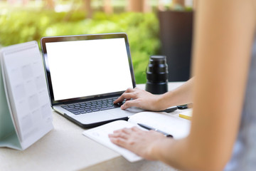 Woman planning agenda and schedule using calendar event planner. Woman hands using plan to vacation on computer laptop. Calender planner organization management remind concept.