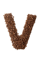 Coffee font alphabet concept isolated on white background. Top view Alphabet made of roasted coffee beans. Collection of brilliant font for your unique idea. Letter V