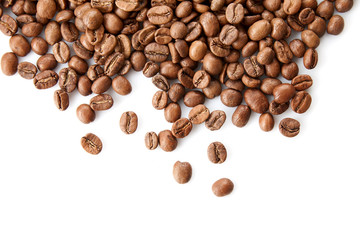 Close up view on Heap of coffee beans isolated on white background. Useful image for design with copy space