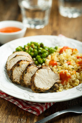 Pork with bulgur and green pea